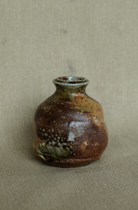 Soda fired wheel throwing bud vase